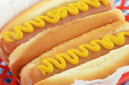 Mustard on hot dogs.