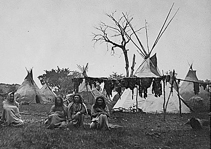 Native americans drying strips of meat.